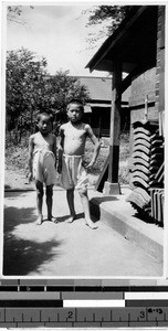 Two boys standing outdoors on a hot day, Tokyo, Japan, 1927