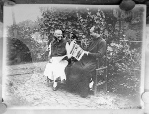 Fr. Vincent Lebbe and Fr. Chao reading the newspaper Icheapo, China, ca. 1906-1919