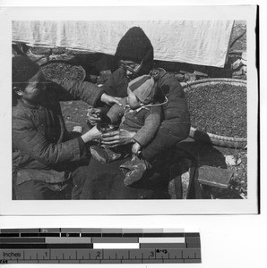 Couple with baby in Guilin, China, 1947