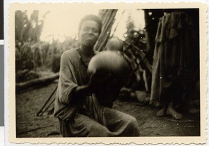 Dietrich Waßmann's landlady making butter, Guduru Gute, Ethiopia, ca.1952-1953