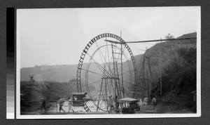 Water wheels near a bridge, Sichuan, China, ca.1900-1920