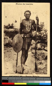 Malgache warrior standing with equippage, Madagascar, ca.1920-1940