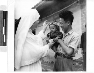 Maryknoll Sister with man and child, Kaying, China, ca.1920-1940