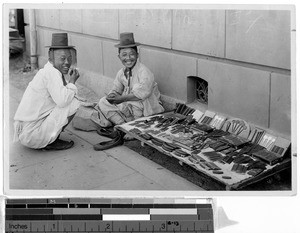 Korean comb merchant and a friend, Korea, ca. 1920-1940