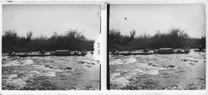 The dugout of missionary Brummer crossing the rapids of Kalé