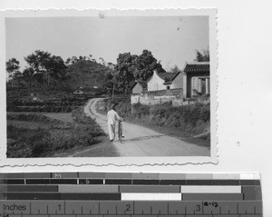 A street scene near Meixien, China, 1936