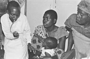 Local health worker testing a child at Rwantege Children's Clinic, the North Western Diocese, T