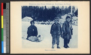 Missionary sister sledding with two orphans, Canada, ca.1920-1940
