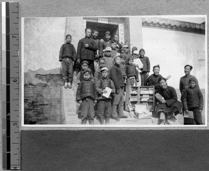 Harwood Bible Training School students bring books to village, Fenyang, Shanxi, China, 1936