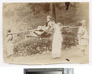 Missionary being taken up hill on a litter, Darjeeling, ca.1890