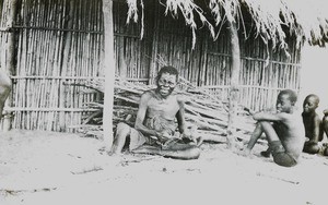 Man and Boys Outside Bamboo Hut, Malawi, ca. 1914-1918