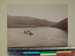 Crossing the Imania river in a boat, Madagascar, 1901