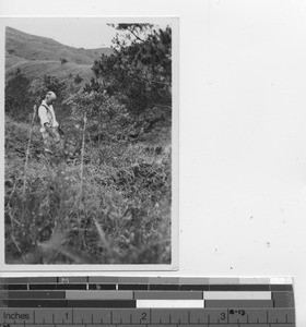 Bro. Lawrence standing on leprosarium property at Jiangmen, China, 1936