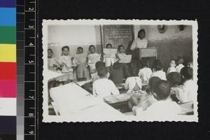 Students and teacher in class room, Ambatomahanga, Madagascar, 1950