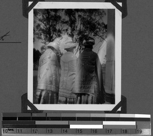 Three women in garments with back embroidery, South Africa East