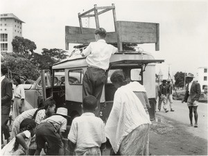 Reverend Nash (FFMA) loads furniture on a pick-up during the flood, in Madagascar