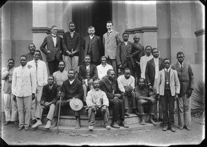 Swiss missionaries and African men in front of the chapel in Khovo, Maputo, Mozambique, ca. 1902-1914