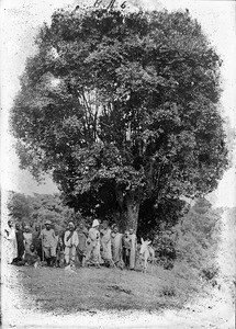 Two missionaries with African men, Tanzania, ca.1893-1920