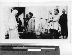 A Maryknoll Sister greets foster mothers at Dongshi, China, 1938