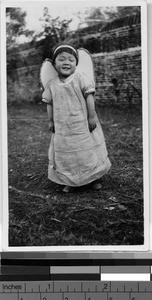 Orphan girl dressed as an angel, Yeung Kong, China, February 16, 1936