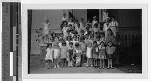 Maryknoll Sister with St. Augustine schoolchildren, Waikiki, Honolulu, Hawaii, ca. 1930-1950