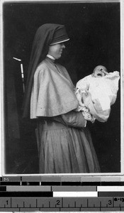 Maryknoll Sisters and baby at orphanange, Fushun, China, June 8, 1934