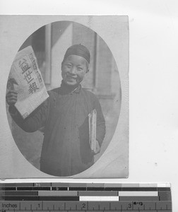 A paper boy at Chihli, China, 1916