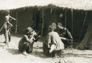 The old friends chat away, in Cameroon