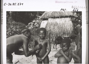 A medecine man in Mbembeland at his work