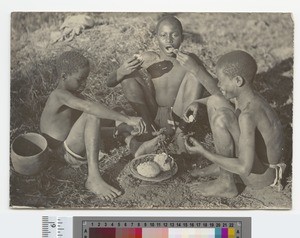 Boys eating outdoors, Malawi, ca.1910