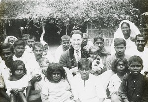 Male missionary and Indian group, India, ca. 1940