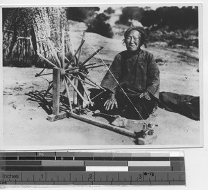 Woman spinning thread at Dalian, China, 1938