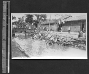 Women and children washing clothes in canal, Chengdu, Sichuan, China, ca.1935