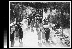 Students and faculty departing from Easter worship service, at Yenching University, Beijing, China, 1930