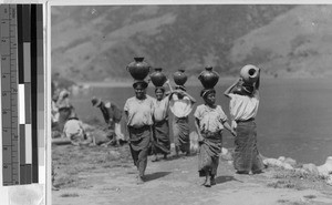 Women carrying water jugs on the shores of Lake Atitlan, Guatemala, ca. 1946