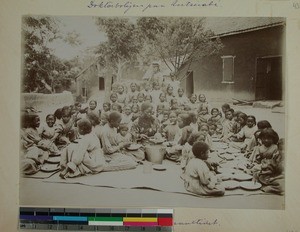 Girls from Antsahamanitra Girls' School eating outside, Antananarivo, Madagascar, ca.1902