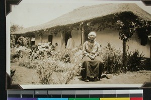 Portrait of woman in front of her residence at Umpumulu, South Africa