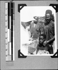 Extracting a tooth, Mbozi, Tanzania, 1937