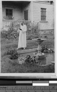 Maryknoll Priest in the garden of his house, Sialoc, Kaying, China, 1932