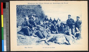 Missionary fathers and others gathered around after a successful hunt, Canada, ca.1920-1940