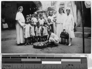 Two Maryknoll Sisters visiting a group of newly baptized children, Manila, Philippines, April 4, 1932