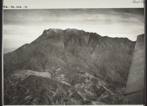 HIGHEST MOUNTAIN IN THE FAR EAST. Photo shows Mount Kinabalu taken during an air journey from Jesselton to Sandakan North Borneo