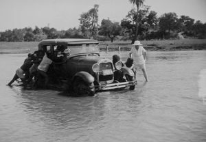 East Jeypore, India. Missionary Ole Christian Jensen's car is stuck in the large river between