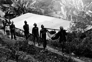 Nepal. A patient is carried to the hospital. Due to long distances, it may take many hours and