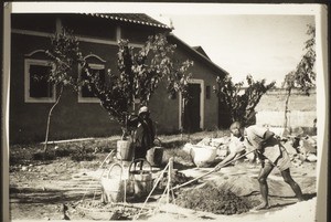 Chinese worker preparing cement