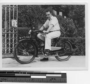 Fr. J.E. Fitzgerald on a motor bike in Jiangmen, China, 1938