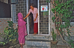 DSM Missionary and Nurse Ulla Bro Larsen meeting another woman at the door, hoping for support