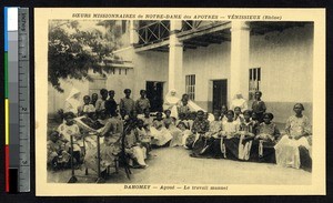 Girls in a courtyard with their sewing projects, Benin, ca.1900-1930