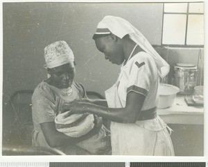Nurse Judith with a patient, Chogoria, Kenya, 1955