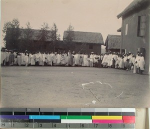 Malagasy men and women lined up outside in the courtyard, Soatanana, Madagascar